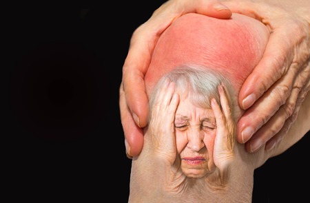 Senior woman holding the knee with painの写真素材