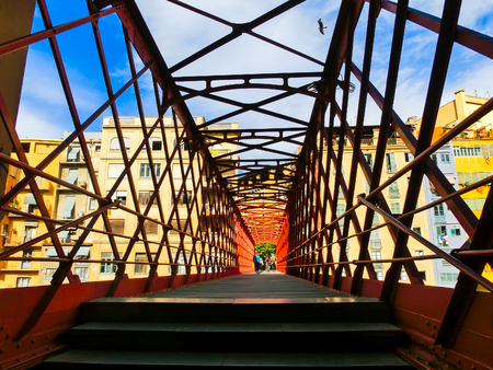Iron bridge and coloured houses in Girona