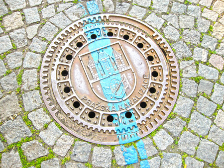 Manhole on old style brick road in Prague, Czech Republicの写真素材