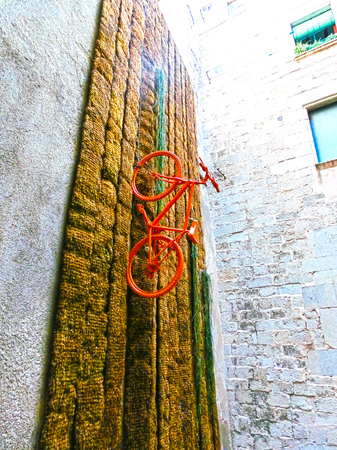 Pals, Girona, Spain - September 15, 2015: The wall with installation at Old town of Pals in Girona, Catalonia, Spain.のeditorial素材