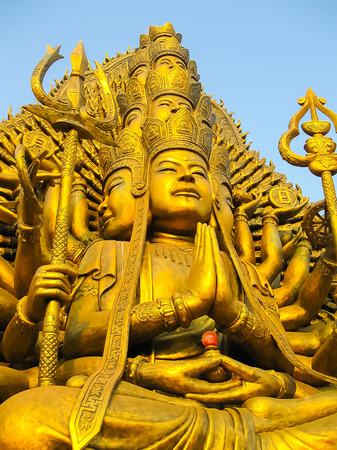Buddha statue on a blue sky backgroundの写真素材