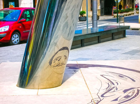 Figueres, Spain - May 07, 2007: The unclear image on the ground is reflected on to the cylindrical pillar to form the image of the Salvador Dali with his famous moustacheのeditorial素材