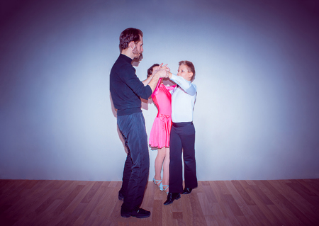 The young boy and girl posing at dance studioの写真素材