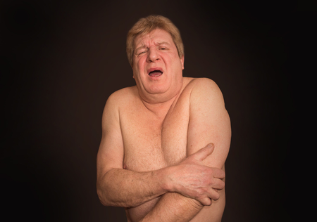 Senior man with osteoarthritis painの写真素材