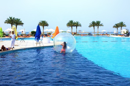 Sharm El Sheikh, Egypt - April 09, 2017: The girl in an inflatable balloon, having fun on the water.のeditorial素材