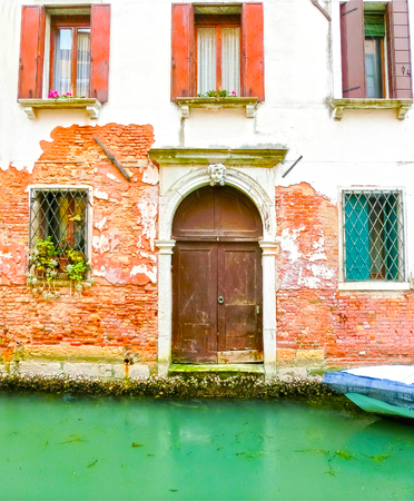 Classical picture of the venetian canals with boats across canalの写真素材