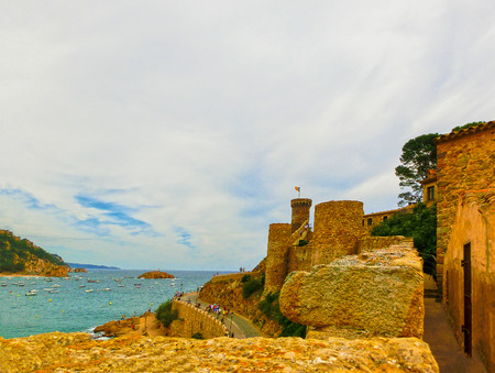 View through walls of ancient fortress in Tossa de mar. Costa Brava, Spainの写真素材