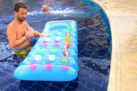 Sharm el Sheikh -April 12, 2017: Tourist enjoying cocktail in a swimming pool