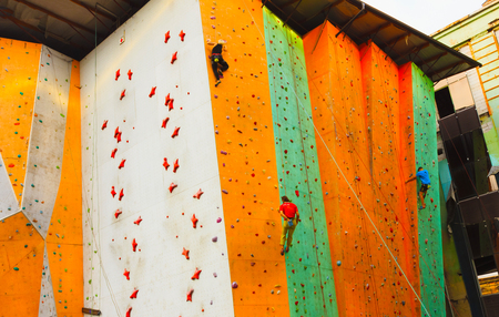 Kyiv, Ukraine - October 8, 2017: The active young woman on rock wall in sport centerのeditorial素材
