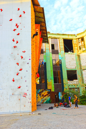 Kyiv, Ukraine - October 8, 2017: The active young woman on rock wall in sport centerのeditorial素材