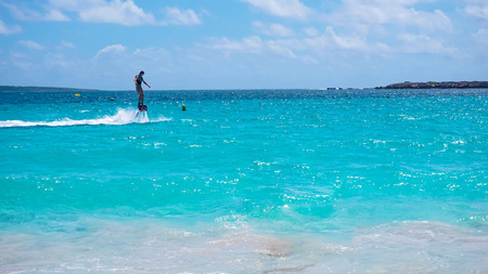 The new flyboard at Caribbean tropical beachの写真素材