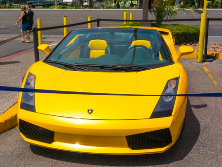 Las Vegas, USA - May 05, 2016: Luxurious and Colorful Cars for Rent Waiting in the Parking Lot of a Supermarketのeditorial素材