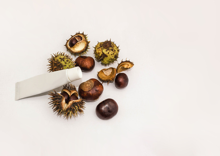 medicine cream from horse chestnuts on white wooden tableの写真素材