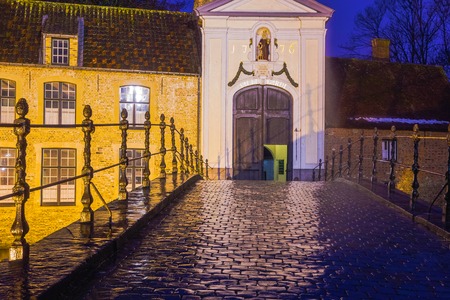 Bruges, Belgium - December 13, 2017: The Beguinage or Begijnhof along a canal across from Minnewater Park in the historic town of Brugesのeditorial素材