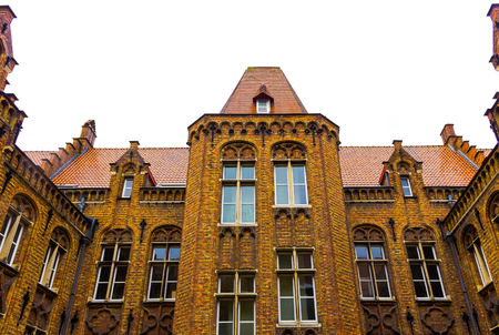 The evening shot of historic medieval building in Bruges, Belgiumの写真素材