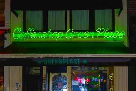 Amsterdam, Netherlands - December 14, 2017: The green neon coffee shop sign.のeditorial素材
