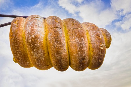 Sign in the form of traditional Czech street food - trdelnik