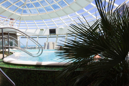 Cape Canaveral, USA - April 29, 2018: The people rest in the bathtub pool at upper deck at cruise liner or ship Oasis of the Seas by Royal Caribbeanのeditorial素材
