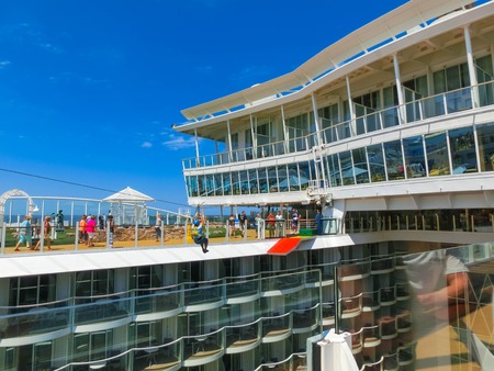 Cape Canaveral, USA - April 29, 2018: The passenger flying at zip line at cruise liner or ship Oasis...