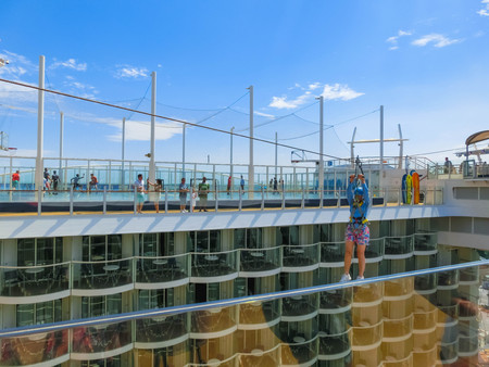 Cape Canaveral, USA - April 29, 2018: The passenger flying at zip line at cruise liner or ship Oasis...