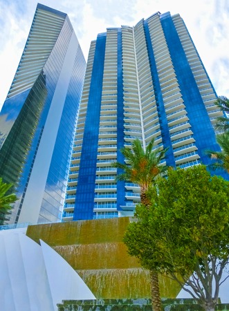 modern apartment buildings with palm treesの写真素材