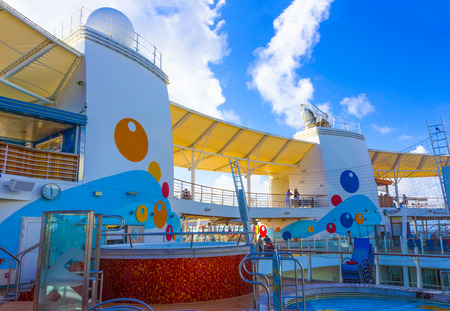 Cape Canaveral, USA - May 04, 2018: The upper deck with childrens swimming pools at cruise liner or ship Oasis of the Seas by Royal Caribbeanのeditorial素材