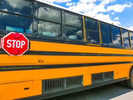 The traditional school buss on freeway road at Orlando, Florida, USAの写真素材