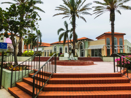 Naples, USA - May 8, 2018: Exterior of a two-story modern resort building at Naples, Floridaのeditorial素材