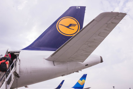 Frankfurt, Germany - April 28, 2018: The people boarding the Lufthansa Airline aircraft. Passenger...