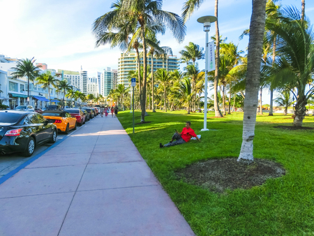 Miami, Usa - May 07,2018: The people resting near Art Deco Historic Districts via famous South Beachのeditorial素材