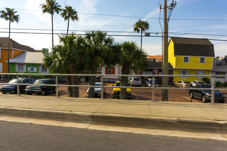 Siesta Key, USA - May 11, 2018: Typical Southwest Florida home in the countryside with palm trees, tropical plants and flowers at Siesta Key, USA on May 11, 2018のeditorial素材
