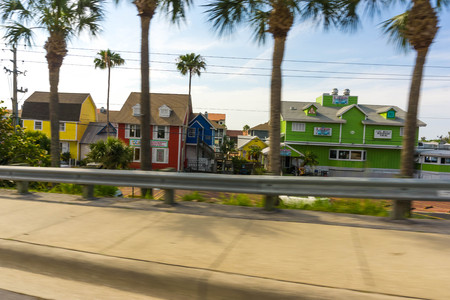 Siesta Key, USA - May 11, 2018: Typical Southwest Florida home in the countryside with palm trees, tropical plants and flowers at Siesta Key, USA on May 11, 2018のeditorial素材