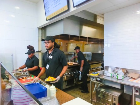 Orlando, USA - May 10, 2018: The kitchen and food dispensers at famous hamburger shop WENDYS at Orlando, USA on May 10, 2018のeditorial素材