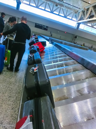 Miami, USA - April 28, 2018: Travelers inside Miami International Airport at Miami, USA on April 28, 2018. The airport ranks first in the United States by percentage of international flights.のeditorial素材