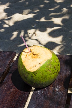 Green coconuts with drinking straw at Jamaicaの写真素材