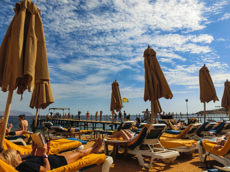 Sharm El Sheikh, Egypt - December 31, 2018: The people at Red sea beach with clean water at in...