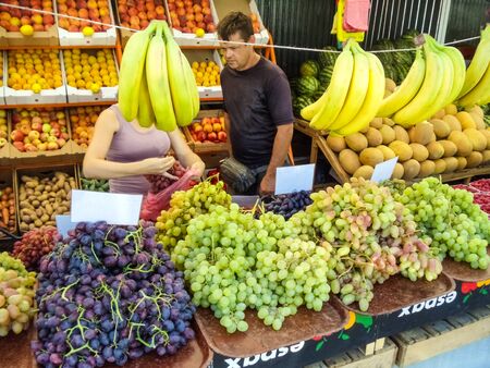 Zaporozhye, Ukraine - August, 26, 2019: Fresh organic fruits at the farmers marketのeditorial素材