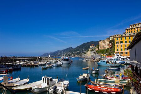 Colorful buildings and beach at Camogli on sunny summer day, Liguria, Italyの写真素材