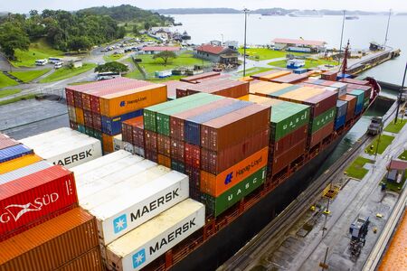 Panama Canal, Panama - December 7, 2019: A cargo ship entering the Miraflores Locks in the Panama...