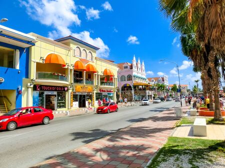 Oranjestad, Aruba - December 4, 2019: Street view of busy tourist shopping district in Caribbean cityのeditorial素材