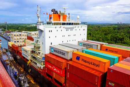 Panama Canal, Panama - December 7, 2019: A cargo ship entering the Miraflores Locks in the Panama...