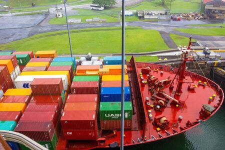 Panama Canal, Panama - December 7, 2019: A cargo ship entering the Miraflores Locks in the Panama Canalのeditorial素材