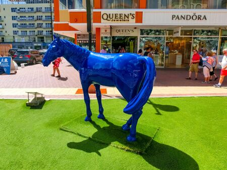 Oranjestad, Aruba - December 4, 2019: Street view of busy tourist shopping district in Caribbean cityのeditorial素材