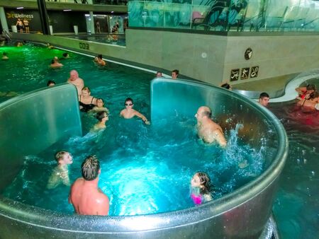 Michalovce, Slovakia - December 30, 2019: People resting at swimming pool in Thermal park Siravaのeditorial素材
