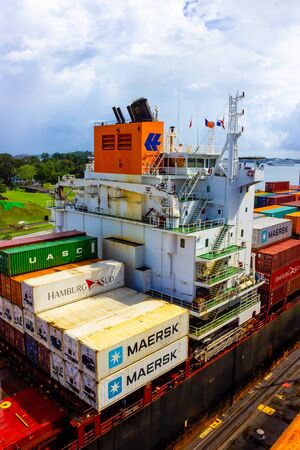Panama Canal, Panama - December 7, 2019: A cargo ship entering the Miraflores Locks in the Panama Canalのeditorial素材