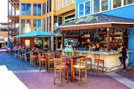 Willemstad, Curacao, Netherlands - December 5, 2019: View of outdoor cafe with clients at some of tables. Tourism concept. Willemstad. Curacao.のeditorial素材