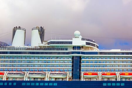 A view of a large cruise ship docked along the waterfront of Bahamas.の写真素材