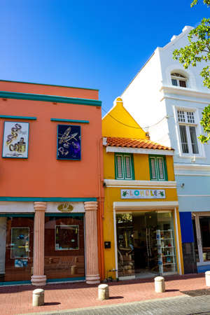 Willemstad, Curacao, Netherlands - December 5, 2019: Specific coloured buildings at street in Curacaoのeditorial素材