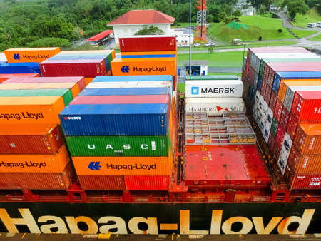 Panama Canal, Panama - December 7, 2019: Hapag-Lloyd cargo ship entering the Miraflores Locks in the...