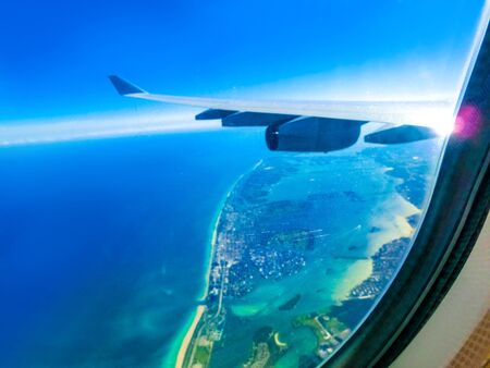 Miami from airplane porthole at sunny day